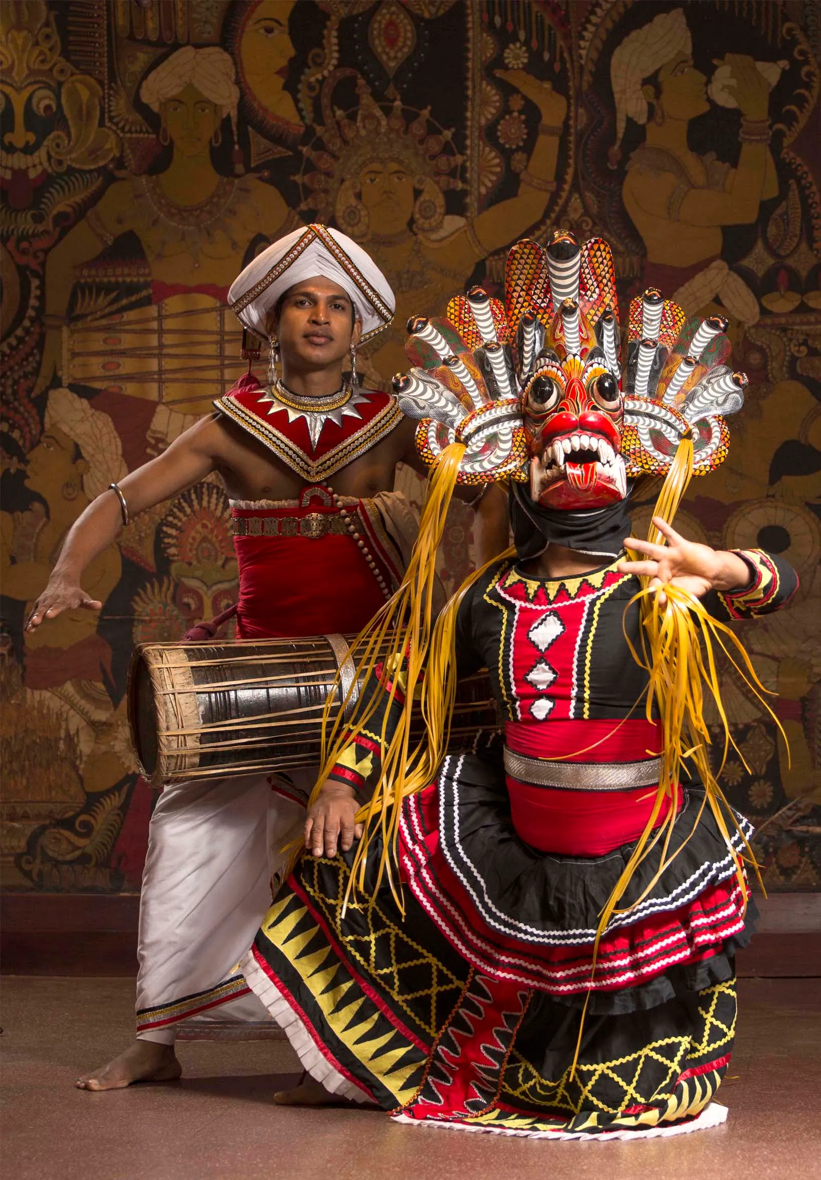 Kandyan dancers in traditional costume performing with drums