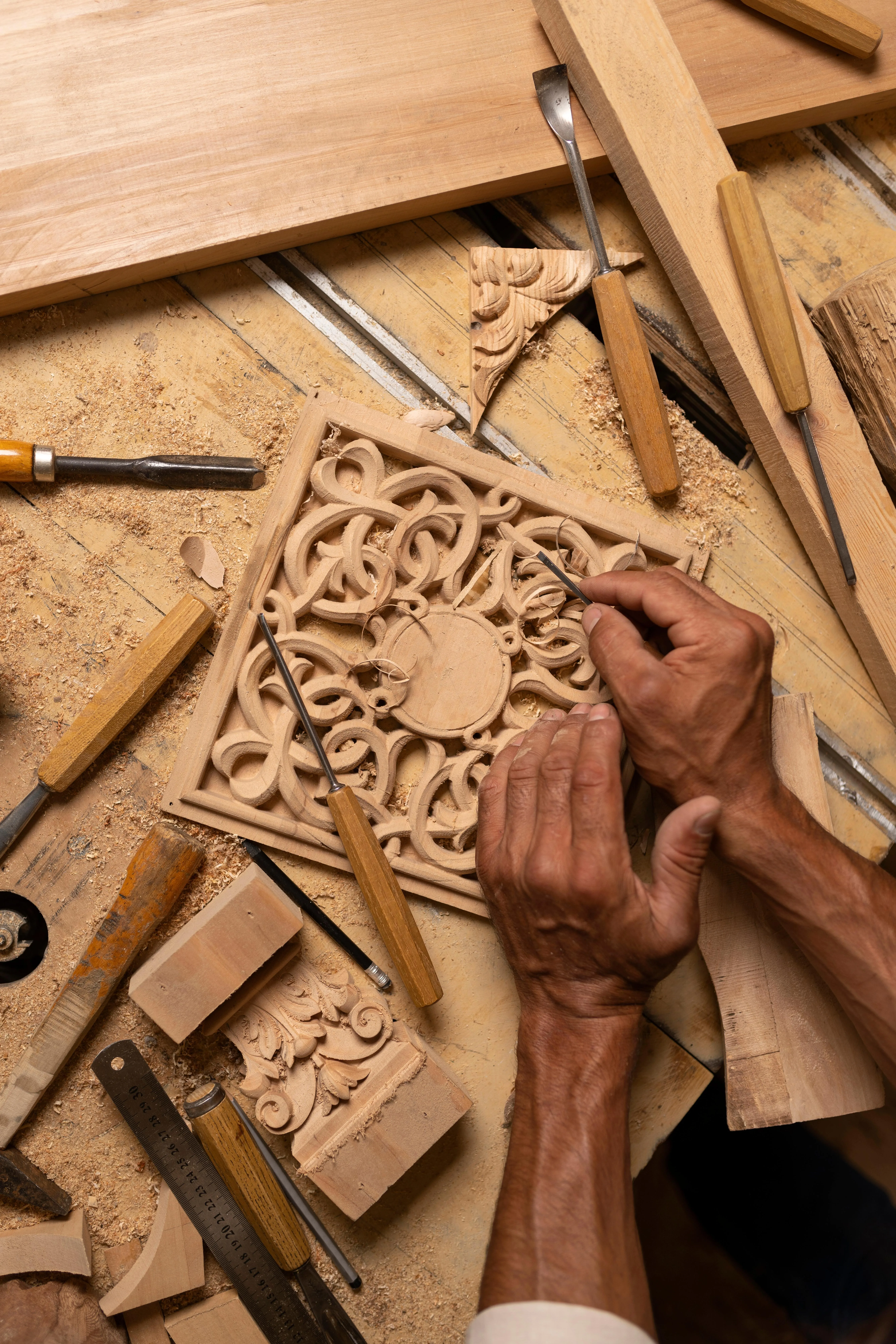 Artisan wood carving traditional motifs in a Kandy workshop